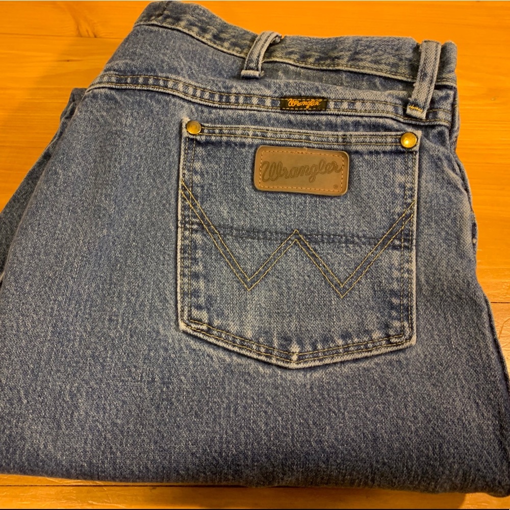 Men’s faded Wrangler jeans
